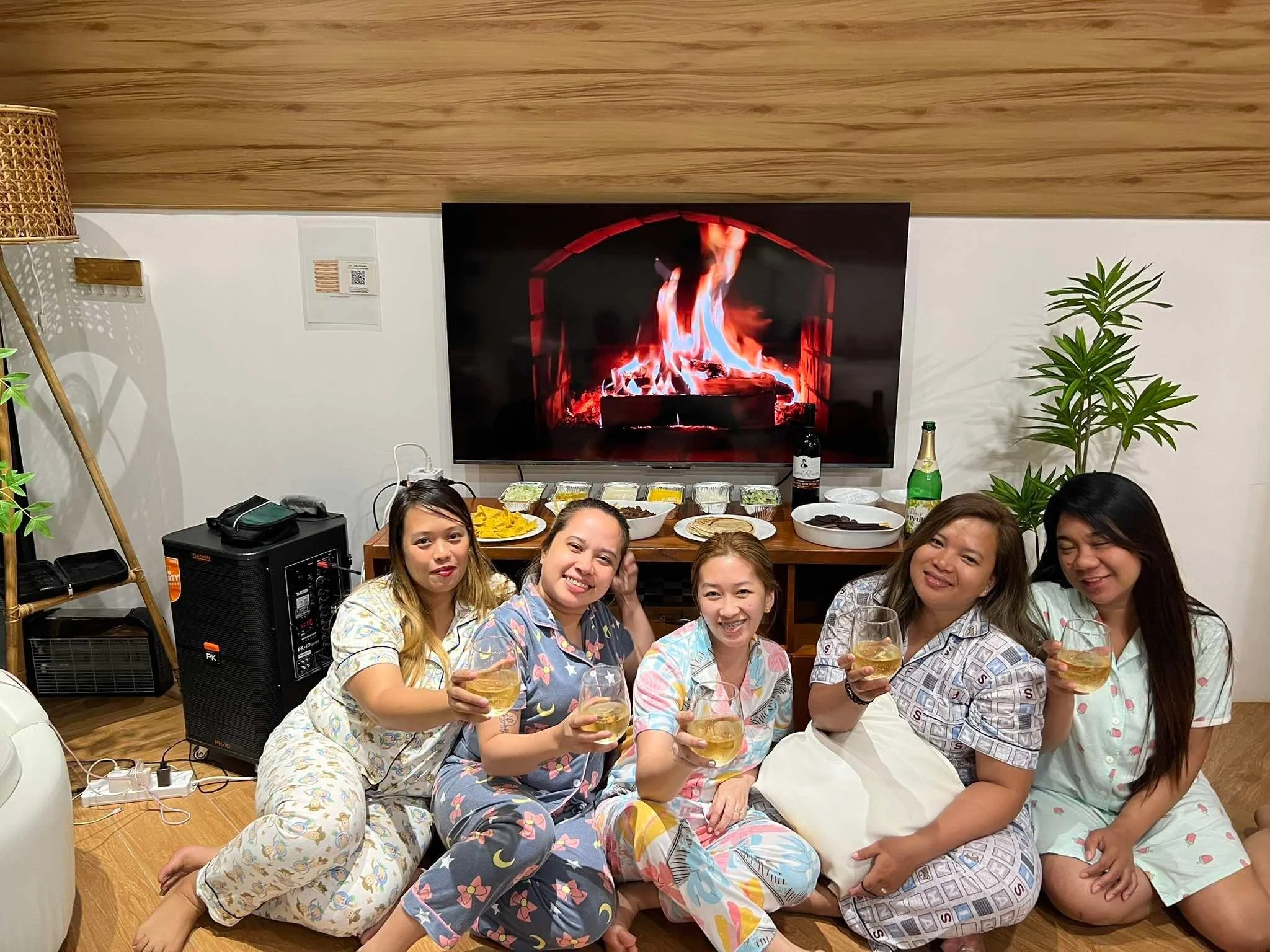 A group of guests seated together in the villa living room at City on a Hill