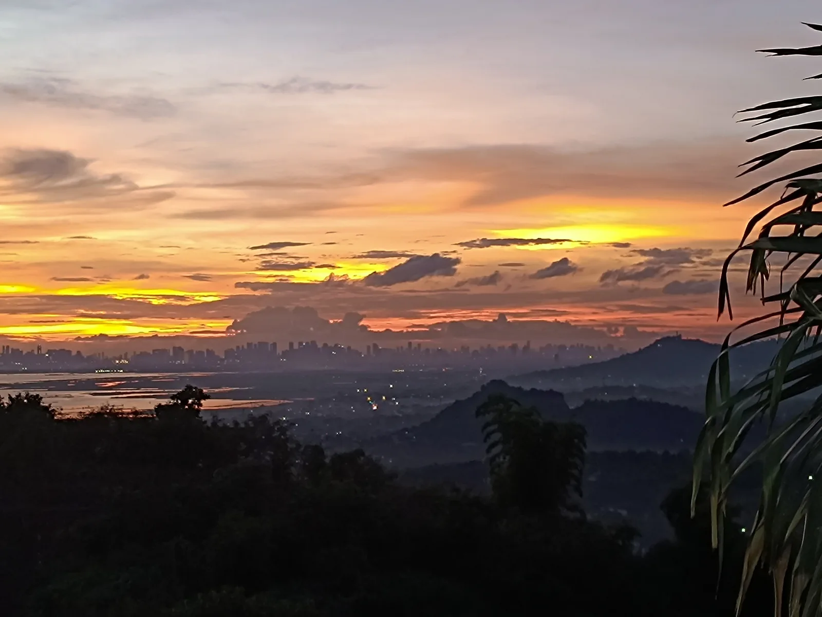 Dusk settling over the Rizal lowlands and city lights, seen from City on a Hill