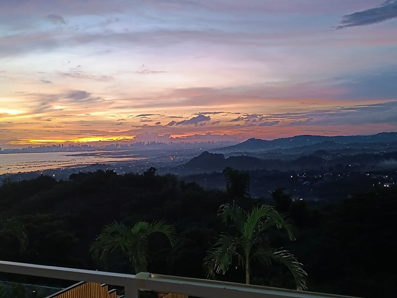 Purple dusk over the Rizal hills and the Metro Manila skyline, seen from City on a Hill