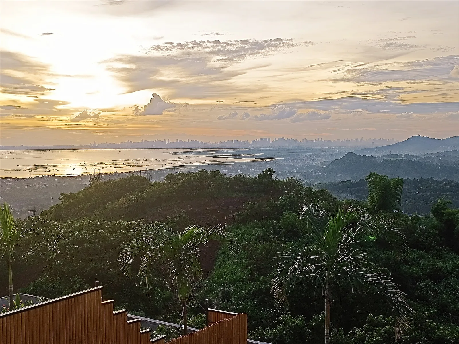 Sunset over the Rizal hills with the Metro Manila skyline on the horizon, seen from City on a Hill