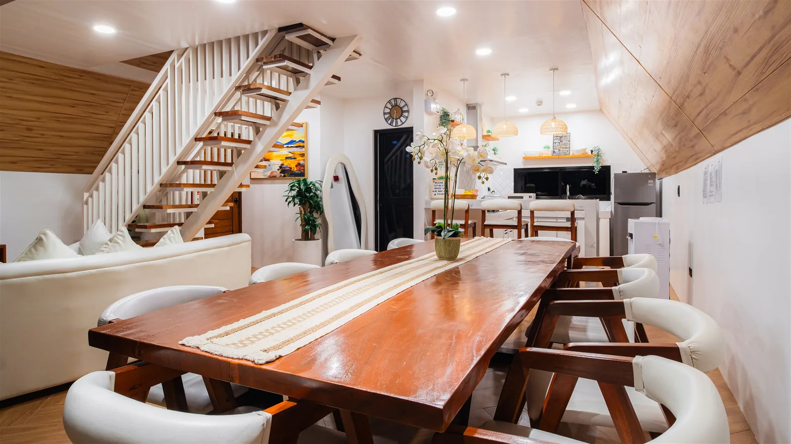 Villa ground-floor dining area with a long wooden table and benches